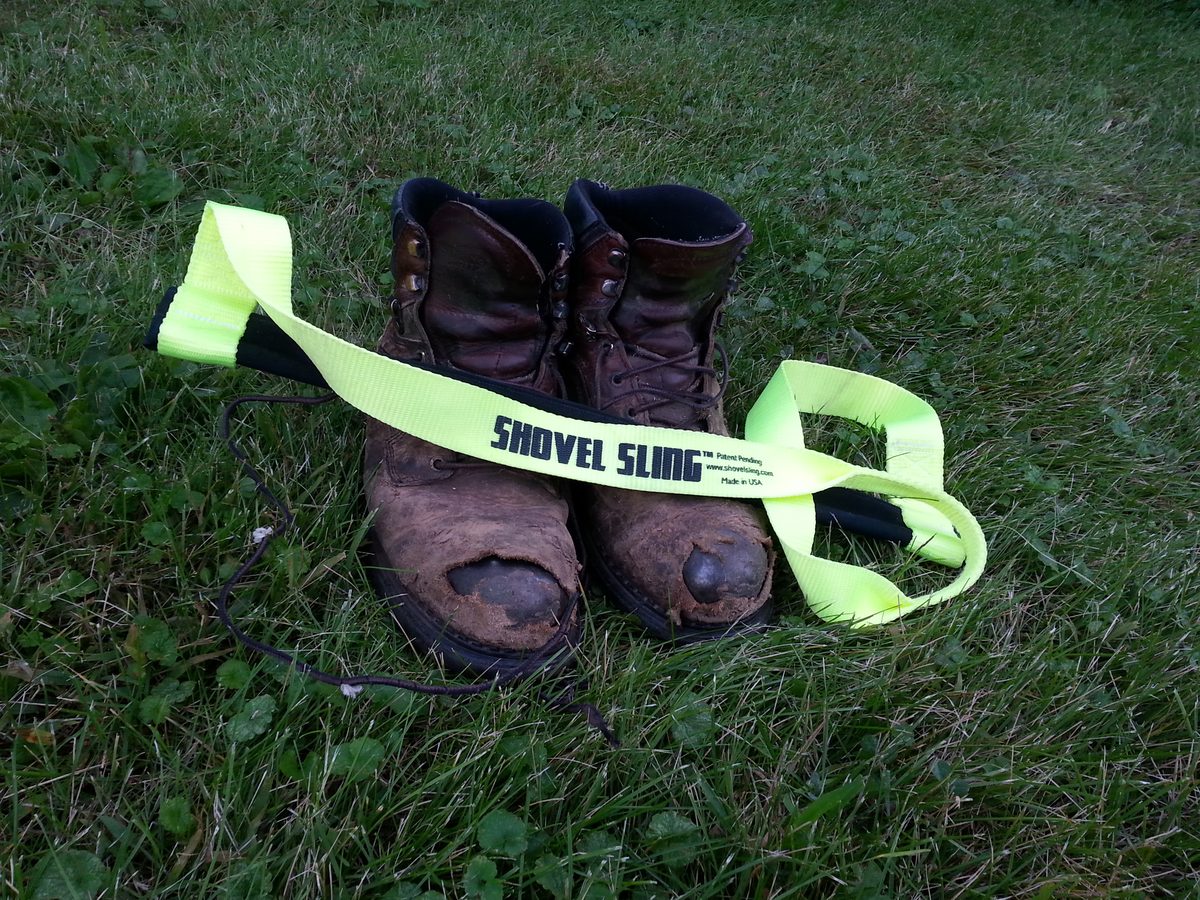 Close-up of the Shovel Sling webbing showing the Shovel Sling logo, www.shovelsling.com and Made in USA label